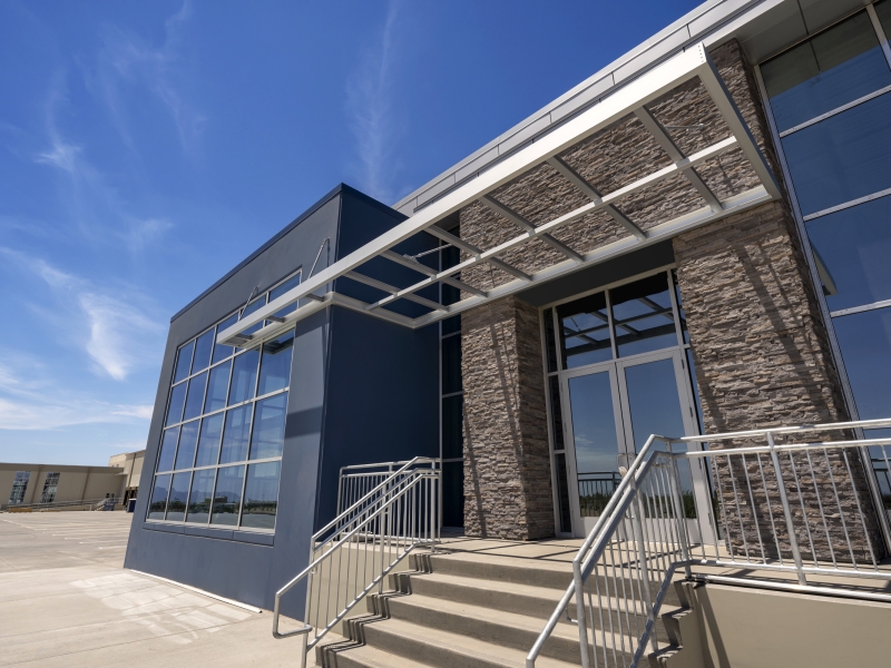 A new cold storage building entrance against a bright blue sky